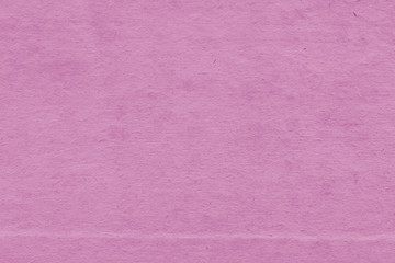 Fototapeta premium Cardboard pink abstract pattern texture close-up. Retro old paper background. Grunge concrete wall. Vintage blank wallpaper.