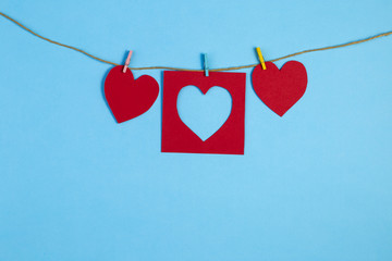 Red hearts made of paper with a place for text greetings