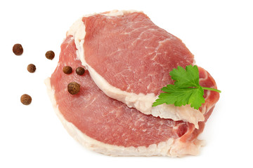 Sliced raw pork meat with parsley and peppercorns isolated on white background. top view