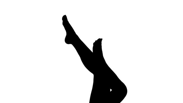 Silhouette of beautiful sexy female legs. Woman imitating running. Holding up woman's legs. Black and white