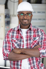 happy construction worker with crossed arms