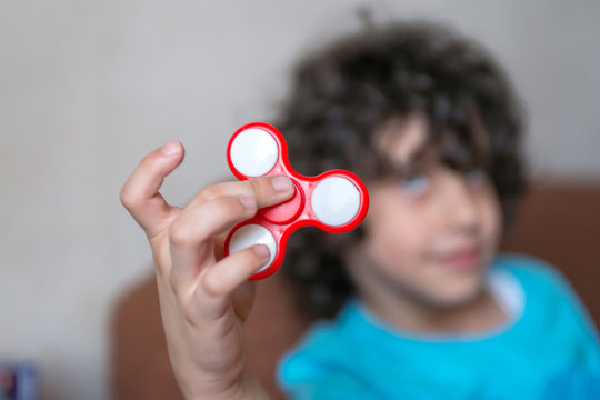 boy playing with spiner