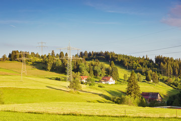 Beautiful view of a high-voltage power line in the Black Forest mountains. Germany.