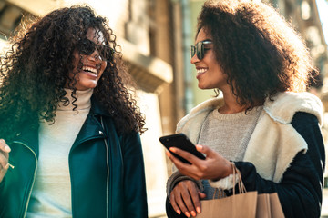 Two beautiful young stylish african women