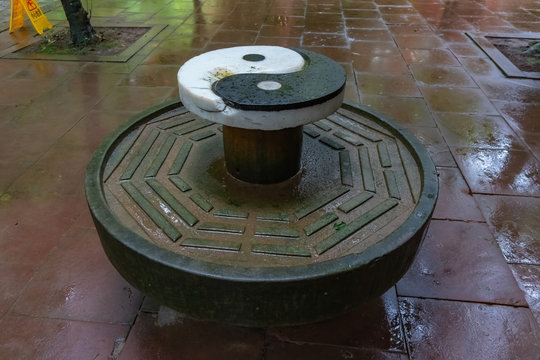 Oratory table with the symbol of Yin Yang and the hexagrams of I-Ching. Leshan Natural Park, Sichuan province, China
