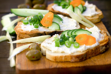 Fototapeta na wymiar Homemade sandwich, sandwich with milk spread and fresh raw vegetables