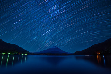 Star trails over Mount Fuji on a clear night from lake Shoji, Yamanashi Prefecture, Japan