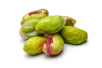 Heap of peeled pistachio nuts isolated