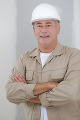 portrait of senior male builder