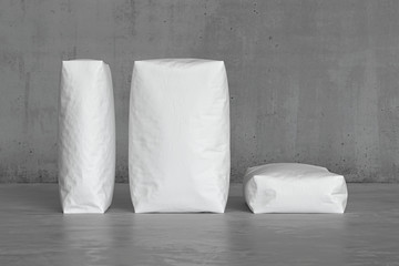 White sacks on the concrete floor. 3d render
