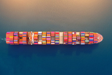 Aerial view of container cargo ship in sea. - obrazy, fototapety, plakaty