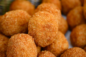 Traditional street food in UK, stuffed Scottish eggs with breadcrumbs