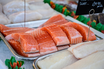 Portions filet fresh red Scottish salmon fish on market