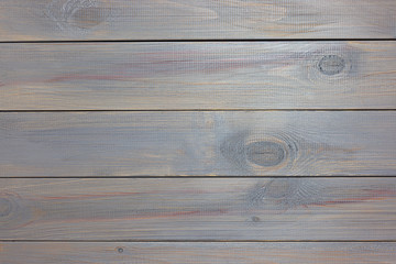 Wooden background made of boards painted with gray paint. Natural wood texture.