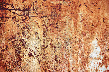 Rusty metal surface with peeled paint and etched numbers. Abstract background texture.