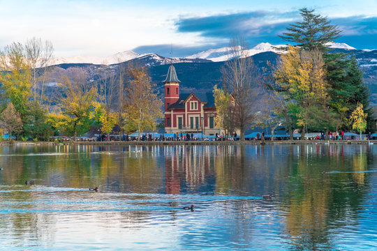 Puigcerd&agrave;, Catalonia / Spain. Lake of Puigcerd&agrave; with Villa Paulita and the snowy Pyrenees in the background