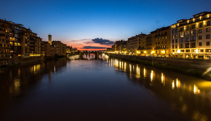 Fototapeta na wymiar reflections of night town in river