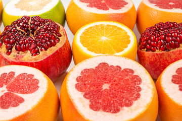 Obraz na płótnie Canvas Grapefruit, orange, pomegranate, citrus sweetie on white background.
