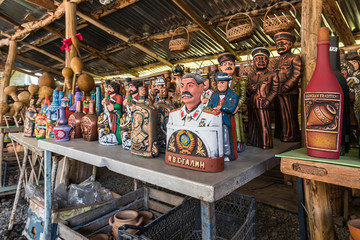 Fototapeta na wymiar Souvenirs for sale exhibited at a roadside gift shop in Imereti in Georgia