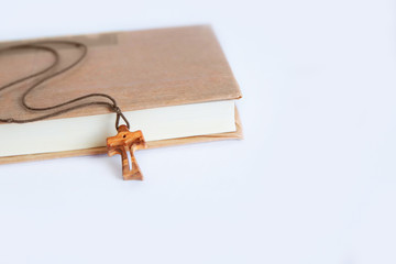 The wooden cross is a symbol and attribute of the Christian faith. Religious objects on a white background.