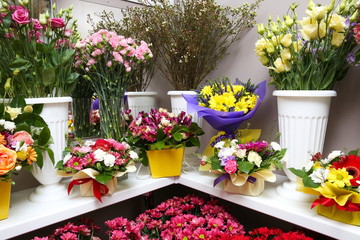 shelf with bouquets of flowers in a flower shop
