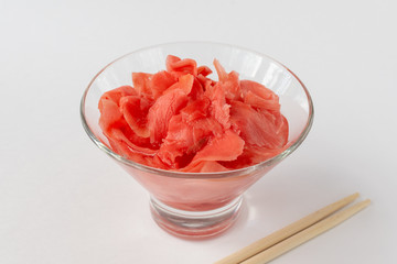 Pickled ginger with wooden sticks.
