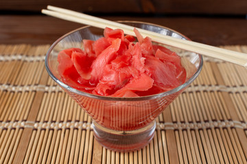Pickled ginger with wooden sticks.