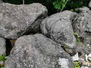 Texture of Big Stones laying on ground in the park