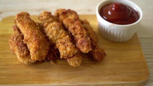 fried chicken stick with ketchup