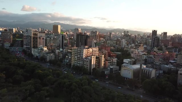 Daan Forest Park and Xinsheng Road, Taipei, Taiwan, Aerial View on Buildingds and Beautiful Sky Under Sunset Sunlight