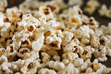 Popcorn on black background, close up 