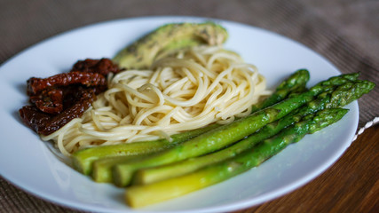 Pasta with asparagus, tomato, avocado and chia