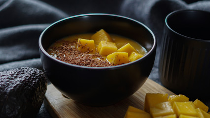Mango mousse with chocolate and slice fruit