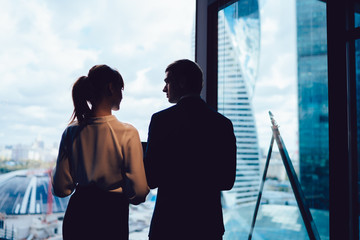 Fototapeta na wymiar Entrepreneurs standing near window at workplace