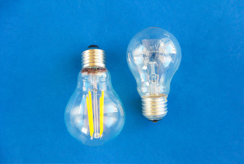 glass round electric lamps for lighting on a blue background