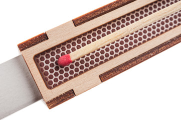 Match friction on the side surface of matchbox close up on white background