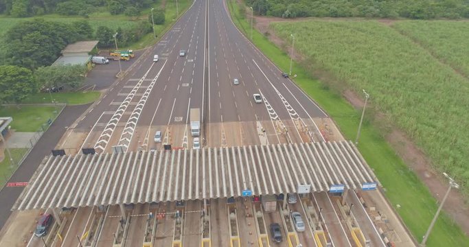 Aerial image highway toll plaza and speed limit, view of automatic paying lanes, non-stop.