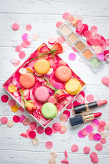 flowers and macaroon on wooden background top view pattern