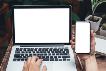 mockup image blank screen computer,cell phone with white background for advertising text,hand woman...