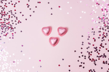 Conffeti hearts on a pink pastel trendy background Valentine's day festive background