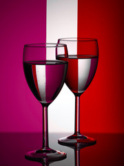 Wine glasses on striped background