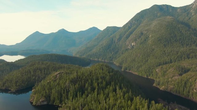 Beautiful Aerial Panoramic View of Larry Lake during a vibrant sunny day. Located on the West Coast of Vancouver Island near Tofino and Ucluelet, British Columbia, Canada.