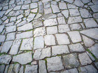 Outdoor stone pavement flooring. Part of a paved street. - 317034623
