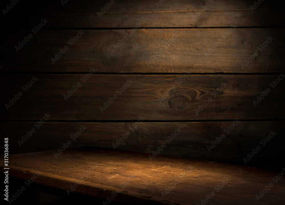 Wall mural wood brown grain texture, dark wall background, top view of wooden table