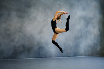 Blond woman jumping in dance class