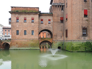 Ferrara, Italy. The moat of the castle and the shower head of water.