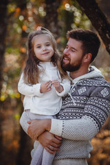 Obraz premium Father and his little daughter during the hiking activities in forest