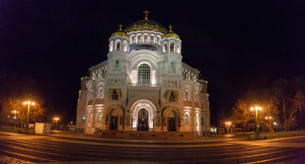 Fototapeta na wymiar The St. Nicholas Wonderworker's Naval Cathedral in the night illumination close-up. Kronstadt, Russia