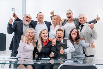 happy group of professional professionals showing thumbs up.