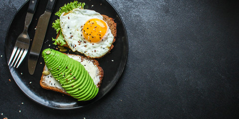 avocado sandwich, healthy food (bread toast snack) menu concept. food background. top view. copy space